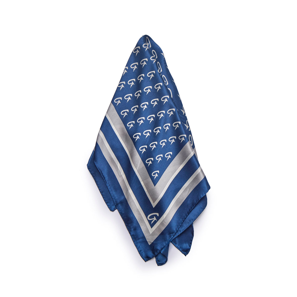 Navy silk scarf featuring a monogram pattern and elegant border, perfect for adding a touch of luxury to any outfit.