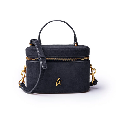 Black mini suede vanity bag with gold zipper and handle, perfect for stylish organization and on-the-go convenience.