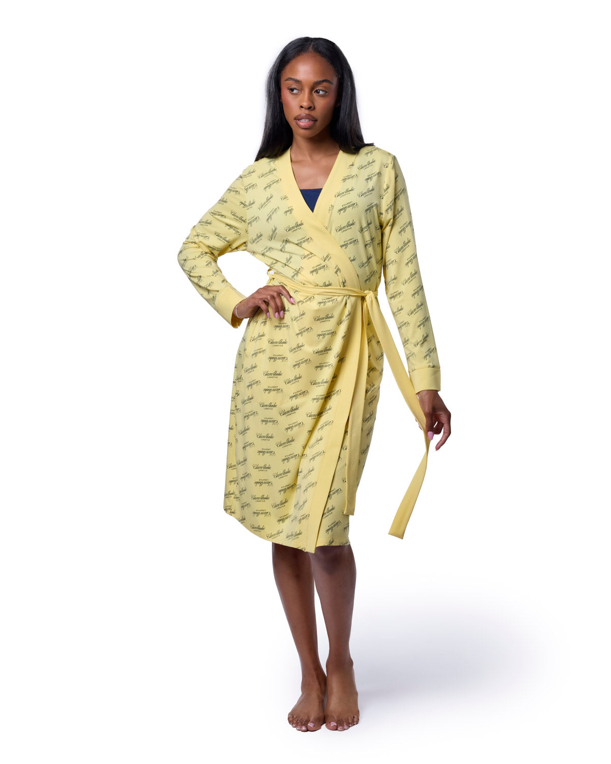 Model wearing a yellow signature luxe robe with a tie waist and long sleeves, featuring a stylish print.