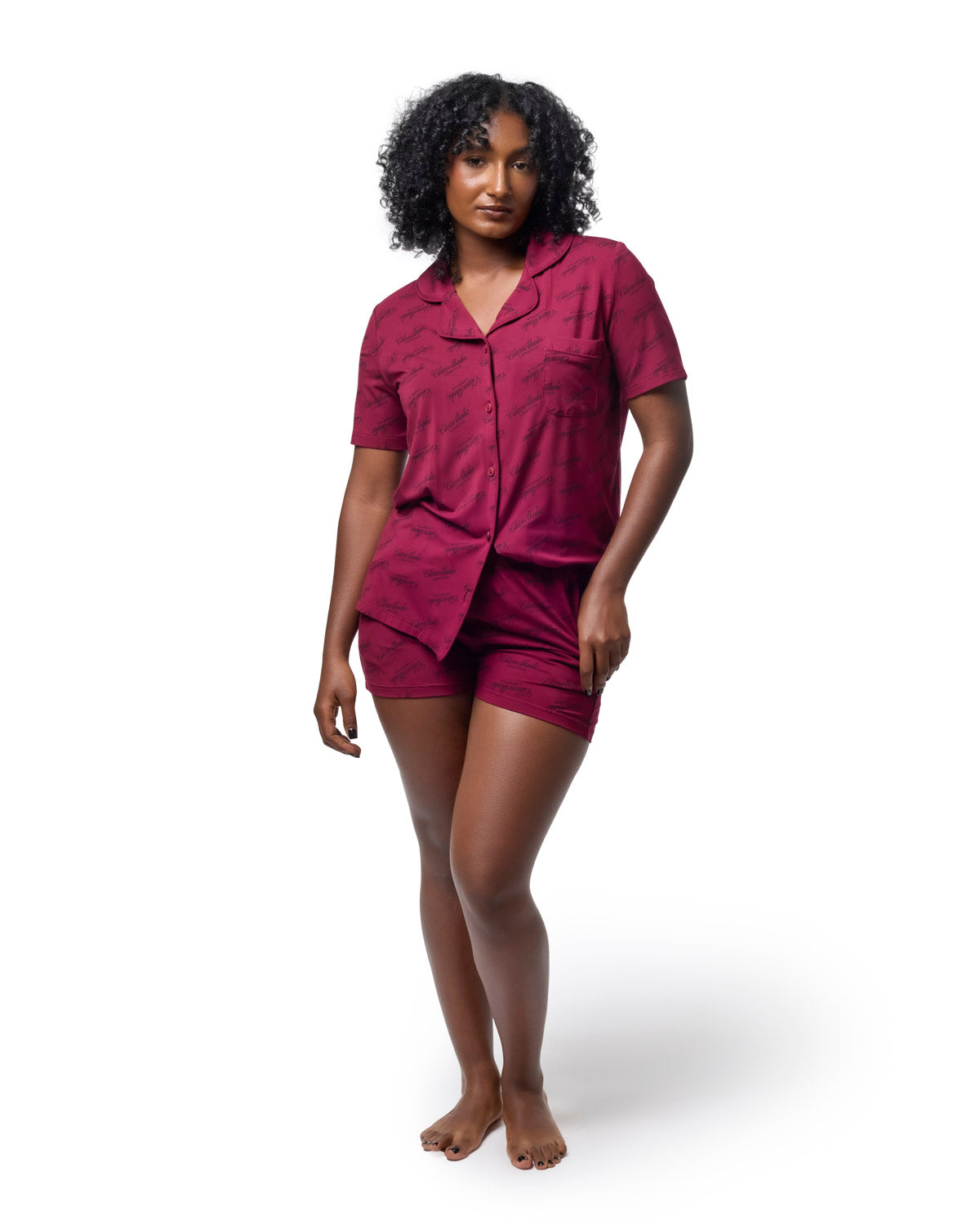 Burgundy short pajama set featuring a button-up shirt and shorts, designed for a stylish and comfortable sleepwear option.