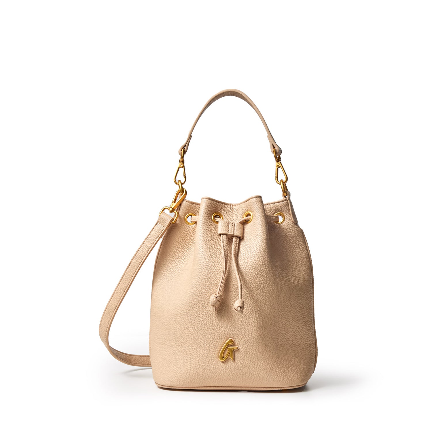 Medium pebble bucket bag in nude with gold hardware, adjustable strap, drawstring closure, and a small gold "G" logo.