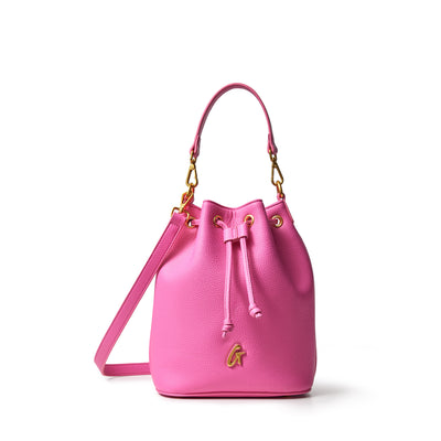 Medium pink pebble bucket bag with gold hardware, adjustable strap, drawstring closure, and a gold "G" charm.