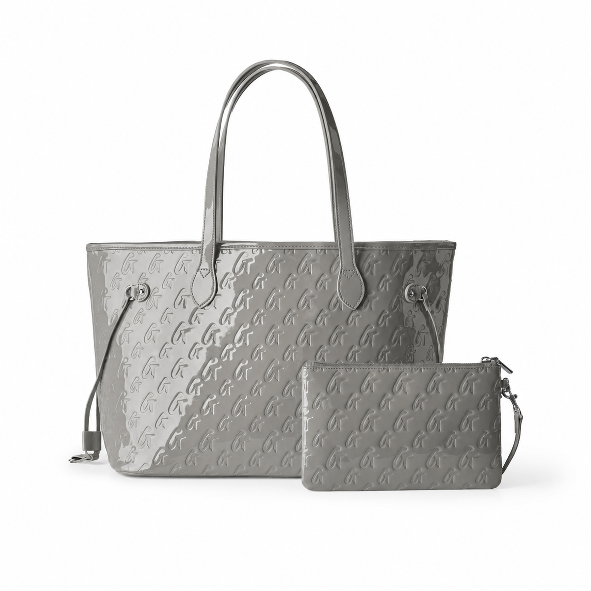 Mirror gray monogram tote bag with matching wristlet, featuring sleek handles and a stylish embossed design.