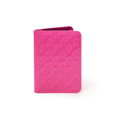 Mirror hot pink monogram passport holder with embossed "G" pattern, glossy finish, and compact design.