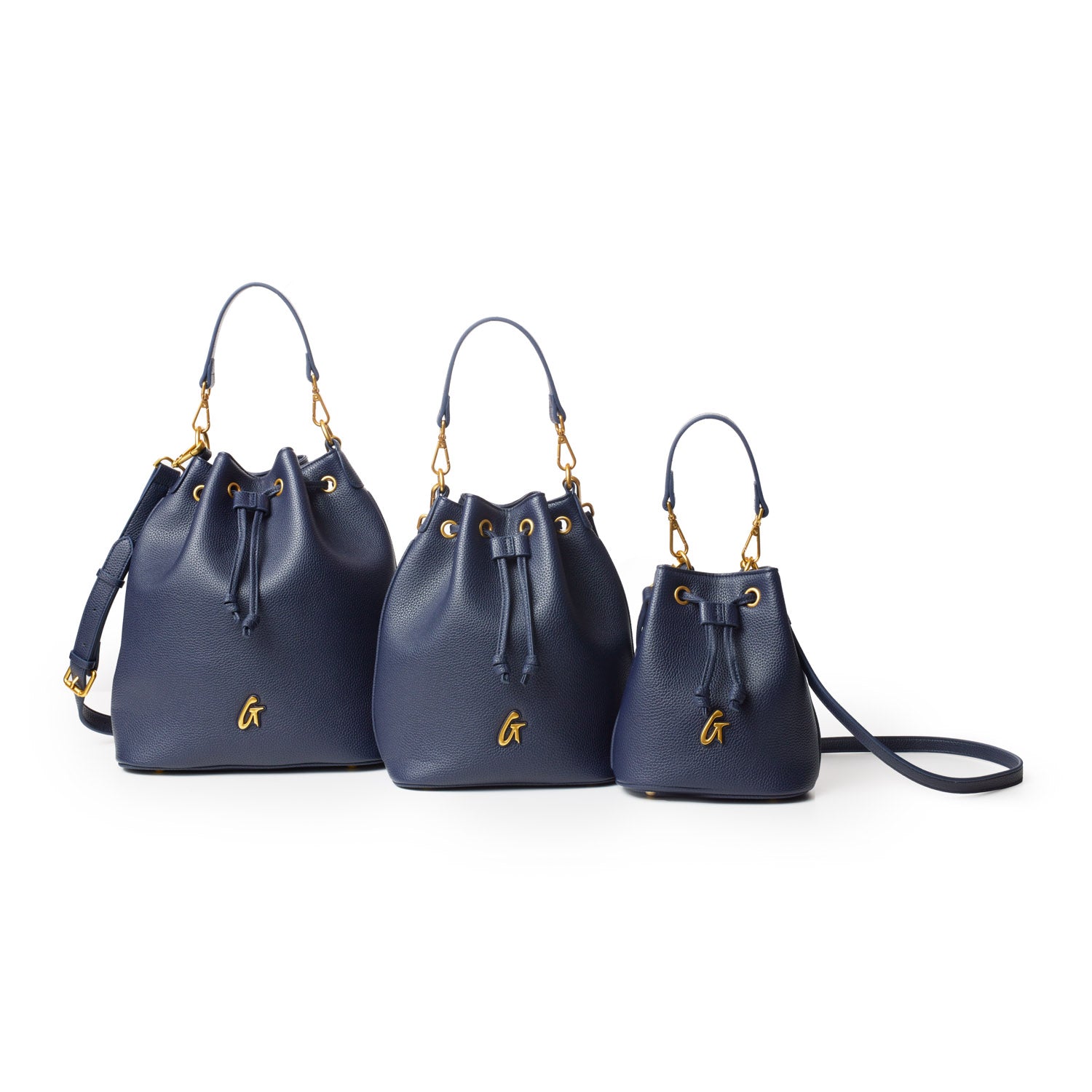 Set of three navy blue medium pebble bucket bags with gold hardware, drawstring closure, and a small gold "G" logo.