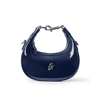 Navy patent leather hobo bag with a sleek design and silver hardware, perfect for stylish everyday use.