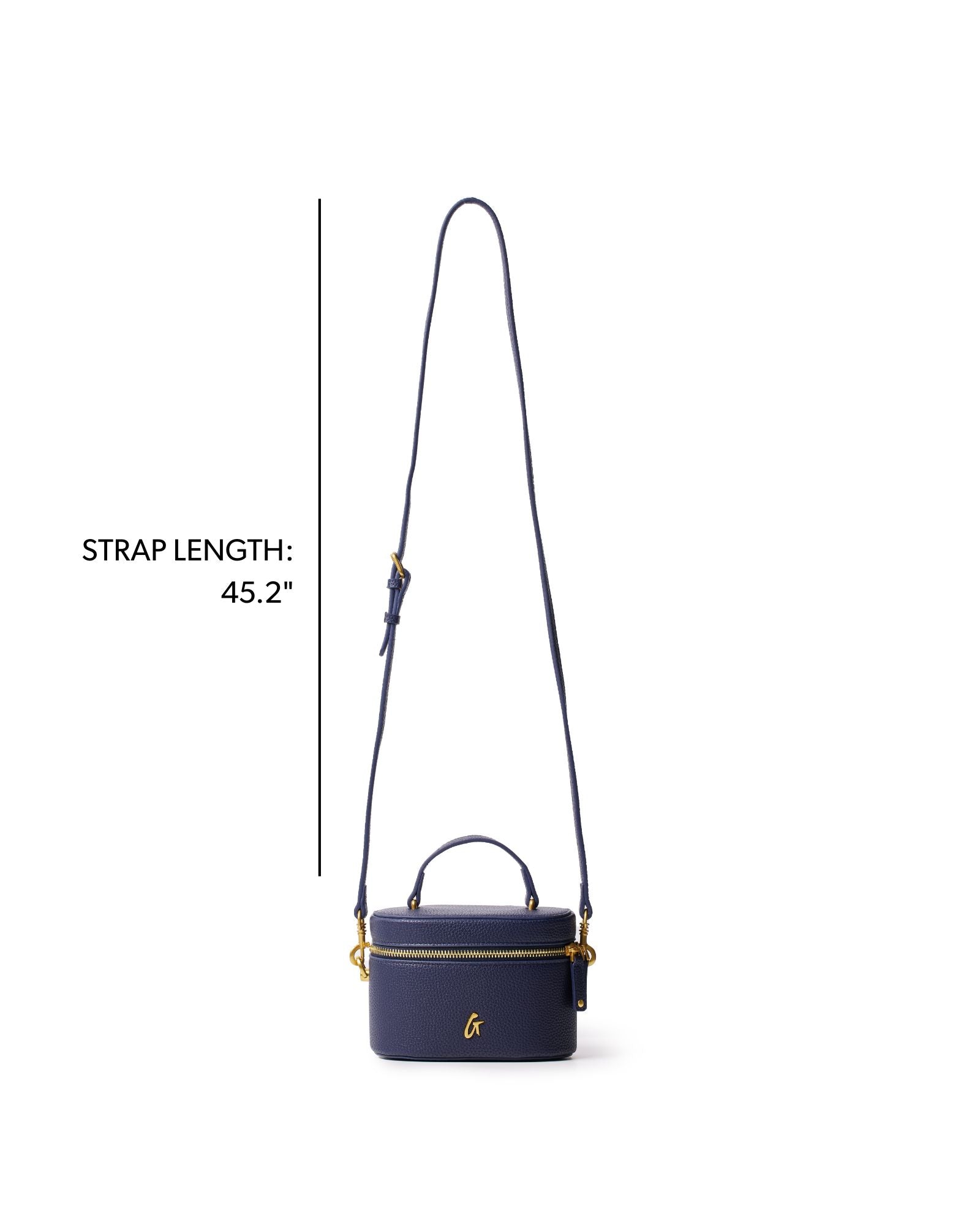 Navy mini pebble vanity bag with a top handle and adjustable strap, perfect for stylish organization on the go.