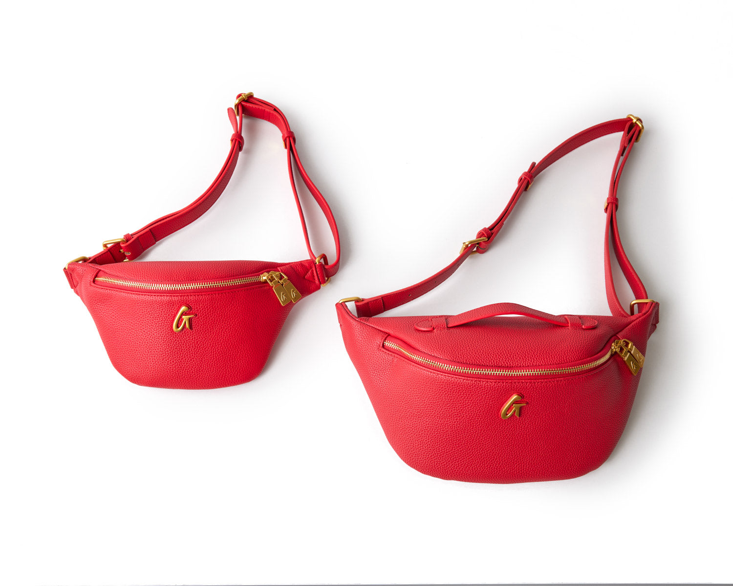 Red Pebble Fanny Packs with gold zippers and logo, adjustable straps, displayed on a white background.