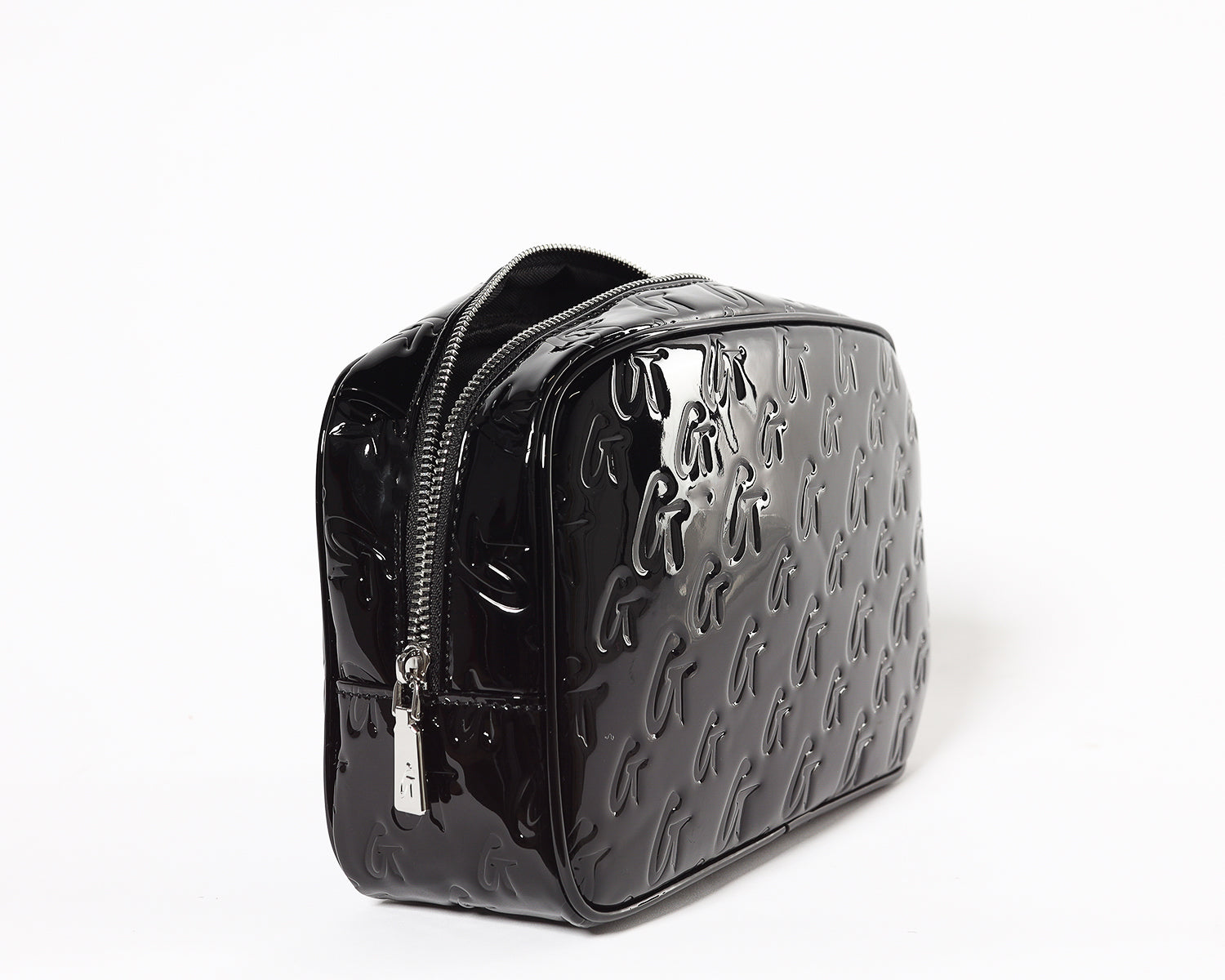 Small black monogram toiletry bag with a glossy finish, embossed with repeated "G" pattern and a mirror.