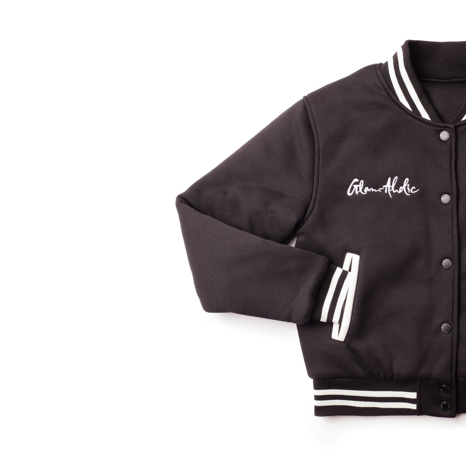 Black varsity jacket with striped cuffs, collar, and waistband, featuring embroidered "Glam-Holic" on the chest.