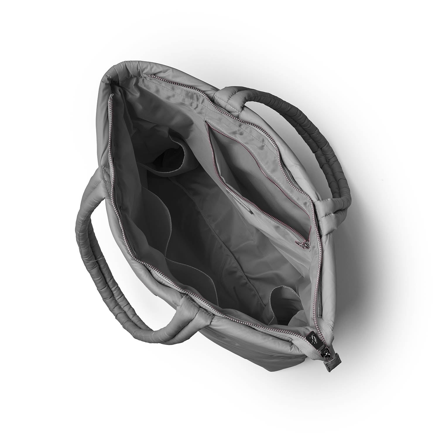 Gray athletic nylon tote bag viewed from above, featuring spacious interior compartments and sturdy handles.