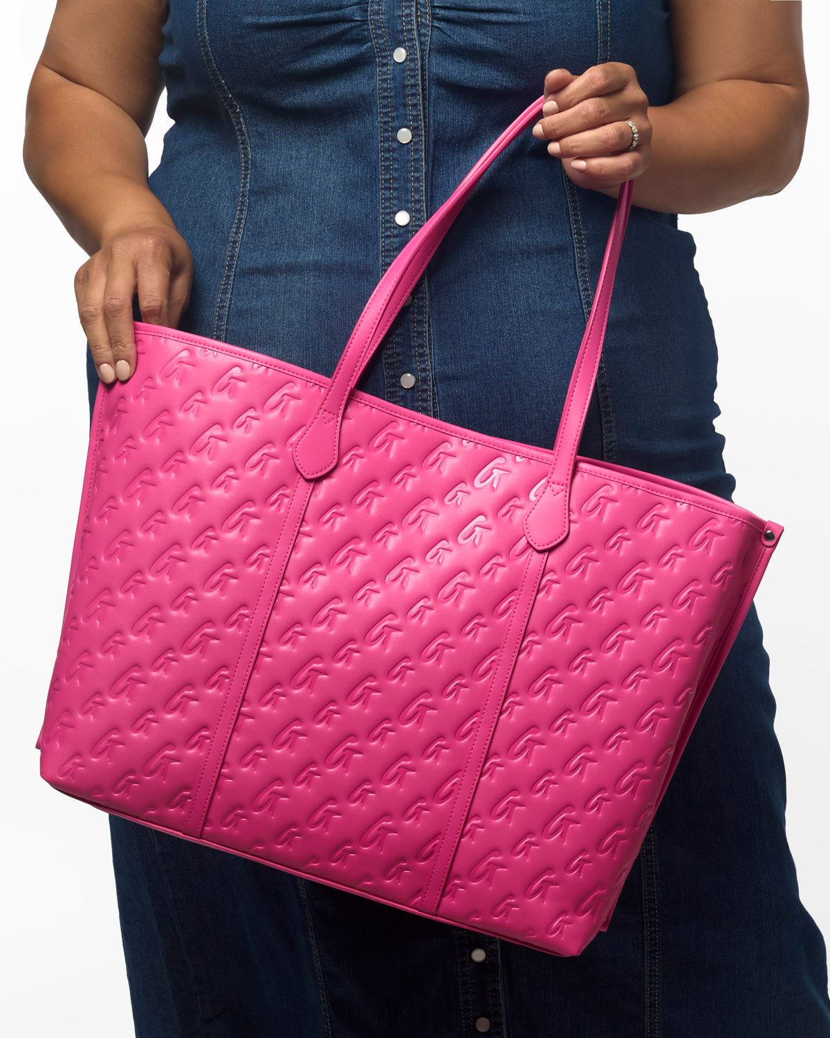 Hot pink XL monogram sleek tote with embossed pattern, perfect for stylish and affordable luxury.