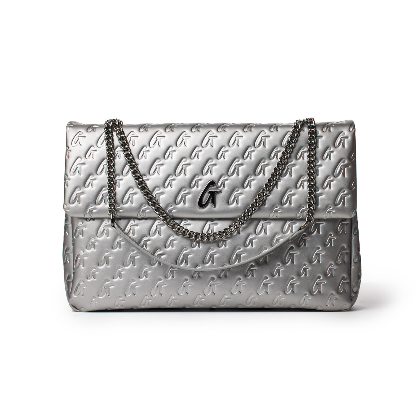 Large platinum Monogram Flap Bag with embossed G pattern, chain strap, and black logo charm.