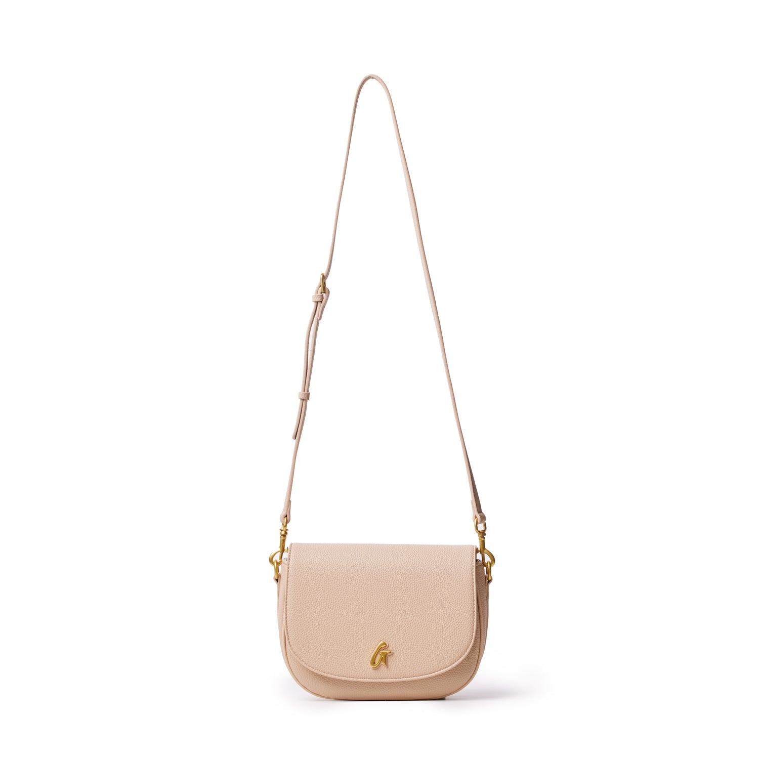 Medium pebble shoulder bag in nude color with a gold logo, adjustable strap, and textured leather finish.
