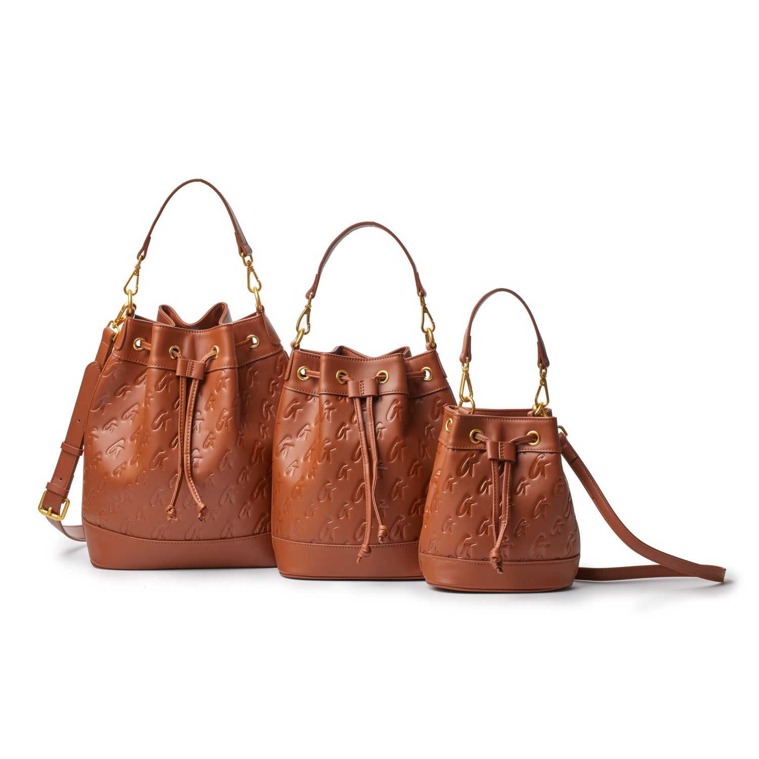 Set of three brown mini bucket bags with embossed logo pattern, gold hardware, and adjustable straps.