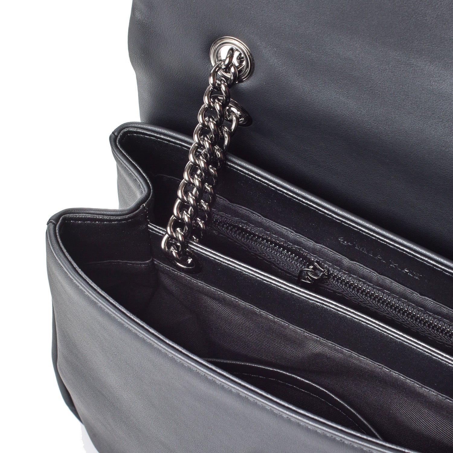 Close-up of a black medium flap bag with a silver chain strap and interior zippered pocket, showcasing sleek, modern design.