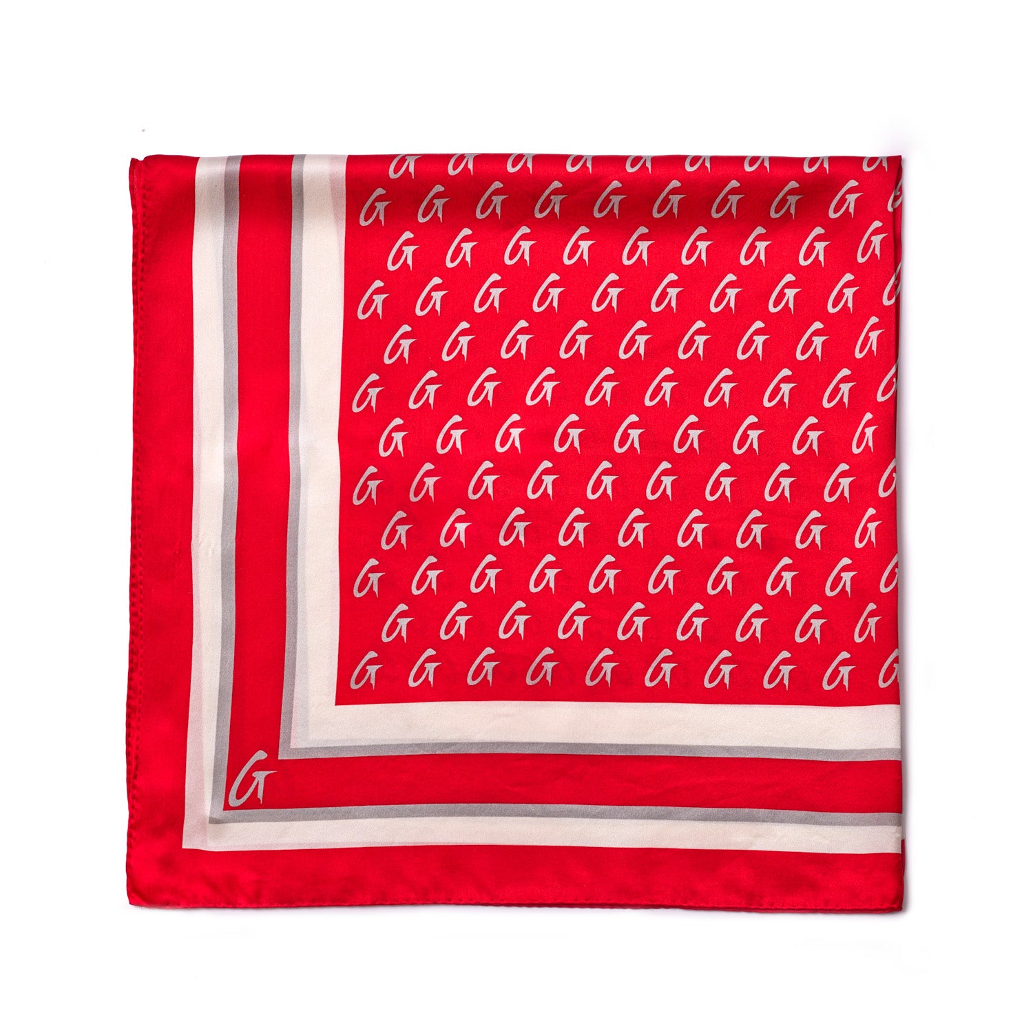 Large red silk scarf with a monogram pattern, featuring white and gray borders and a small logo in the corner.