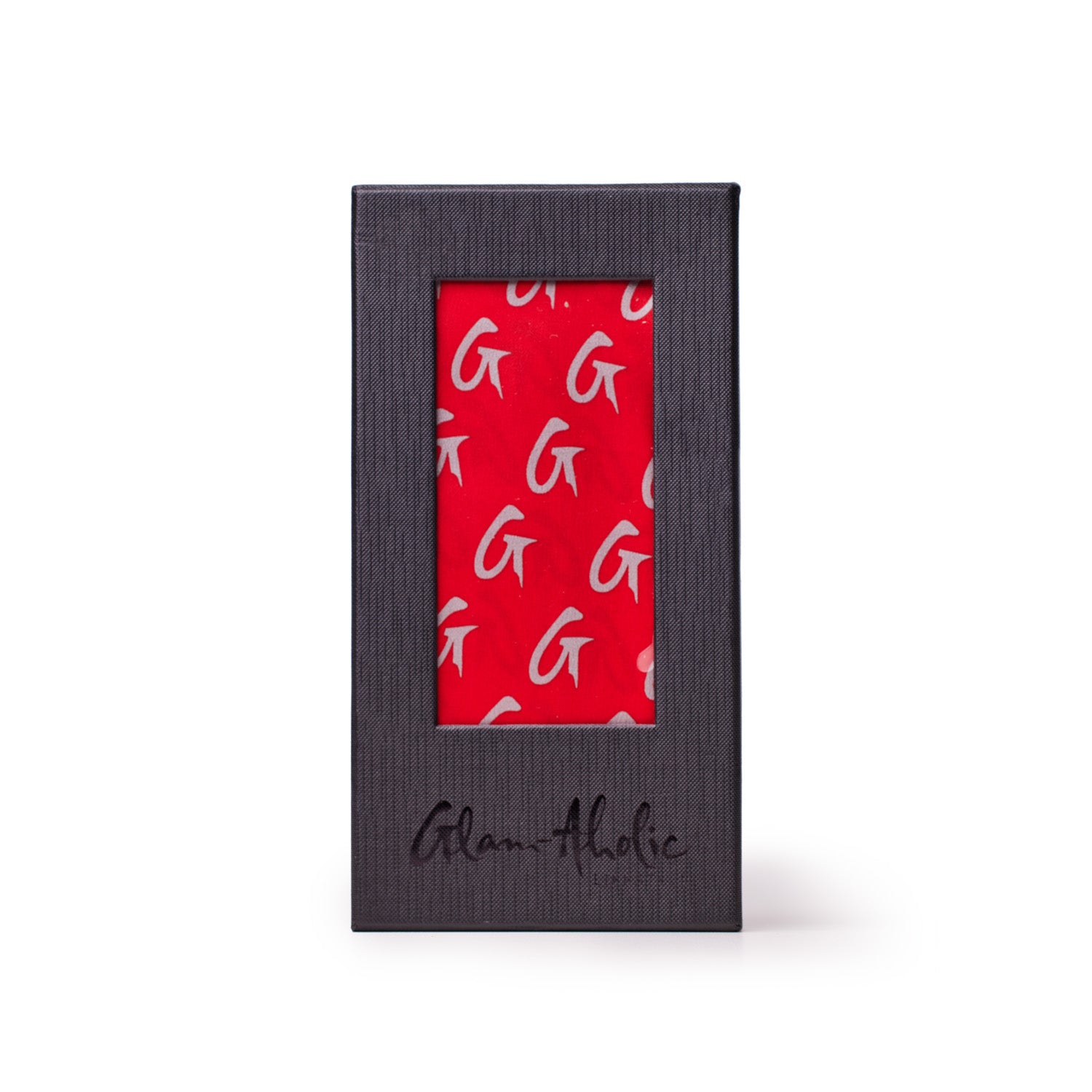 Large red silk scarf with a monogram pattern featuring gray "G" logos, displayed in a black textured box.