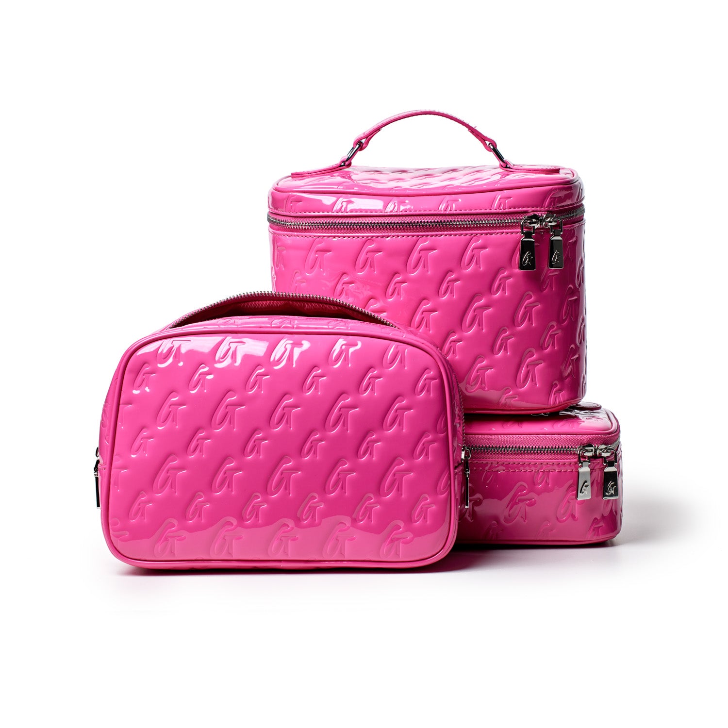 Large hot pink monogram toiletry bag set with embossed "G" pattern, including a mirror, perfect for travel storage.