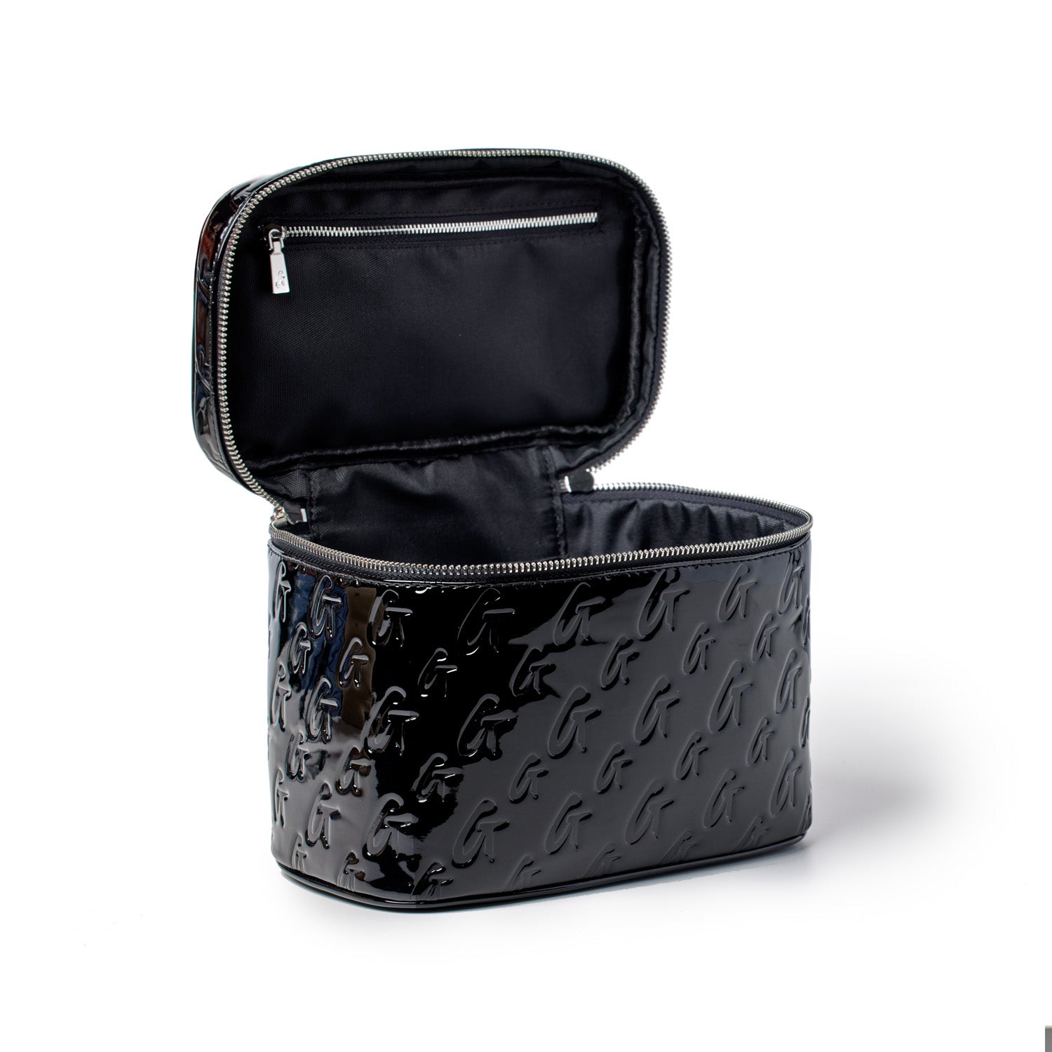 Large black monogram toiletry bag with a glossy finish, embossed with a repeating "G" pattern, open to reveal interior compartments.