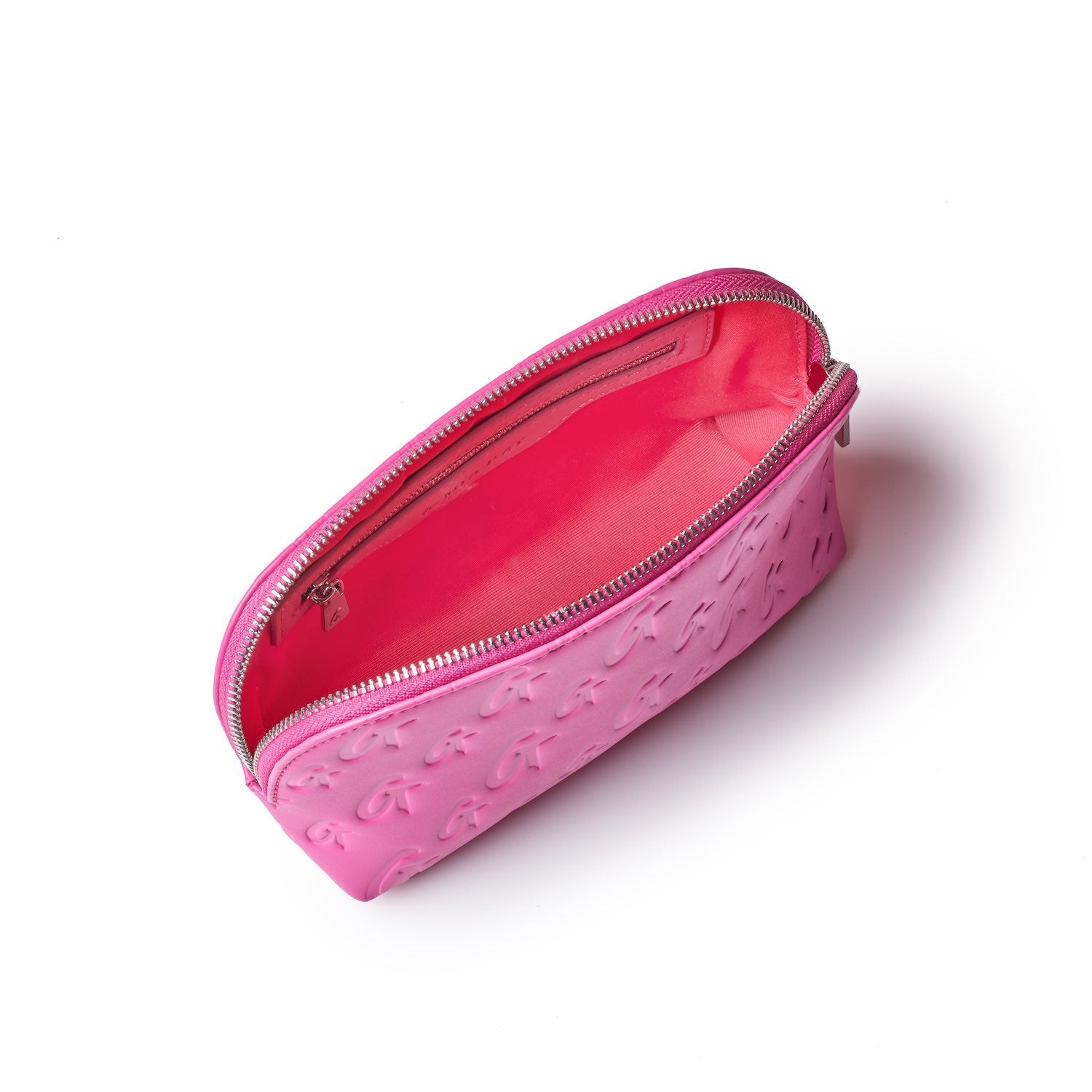 Pink monogram cosmetic pouch with embossed logo pattern, open zipper revealing a pink interior.