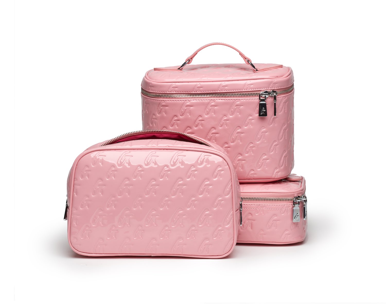 Set of three pink monogram toiletry bags with embossed logo pattern, zippers, and a mirror, ideal for travel organization.