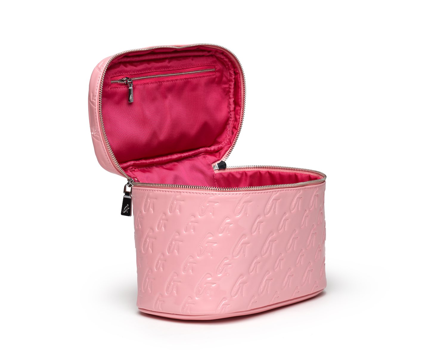 Large pink monogram toiletry bag with embossed logo, open to show bright pink interior and zipper compartments.