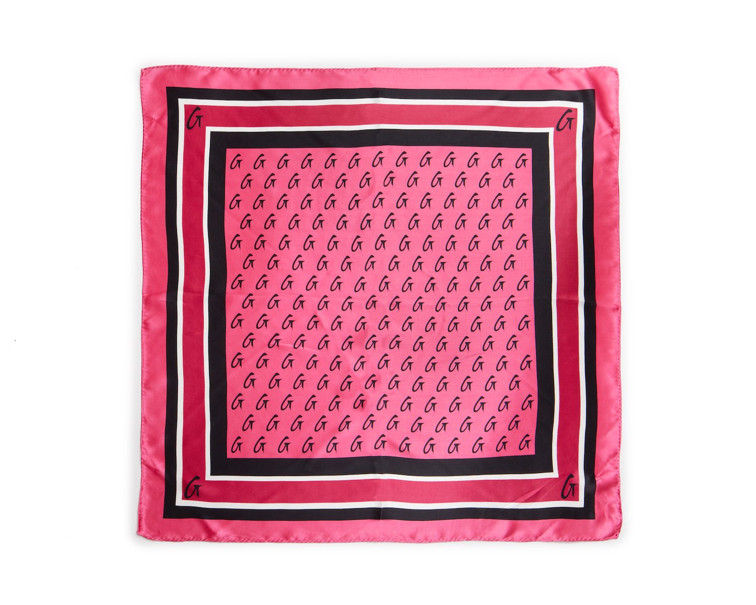 Medium hot pink silk scarf with a black, white, and pink border featuring a monogram pattern and corner initials.