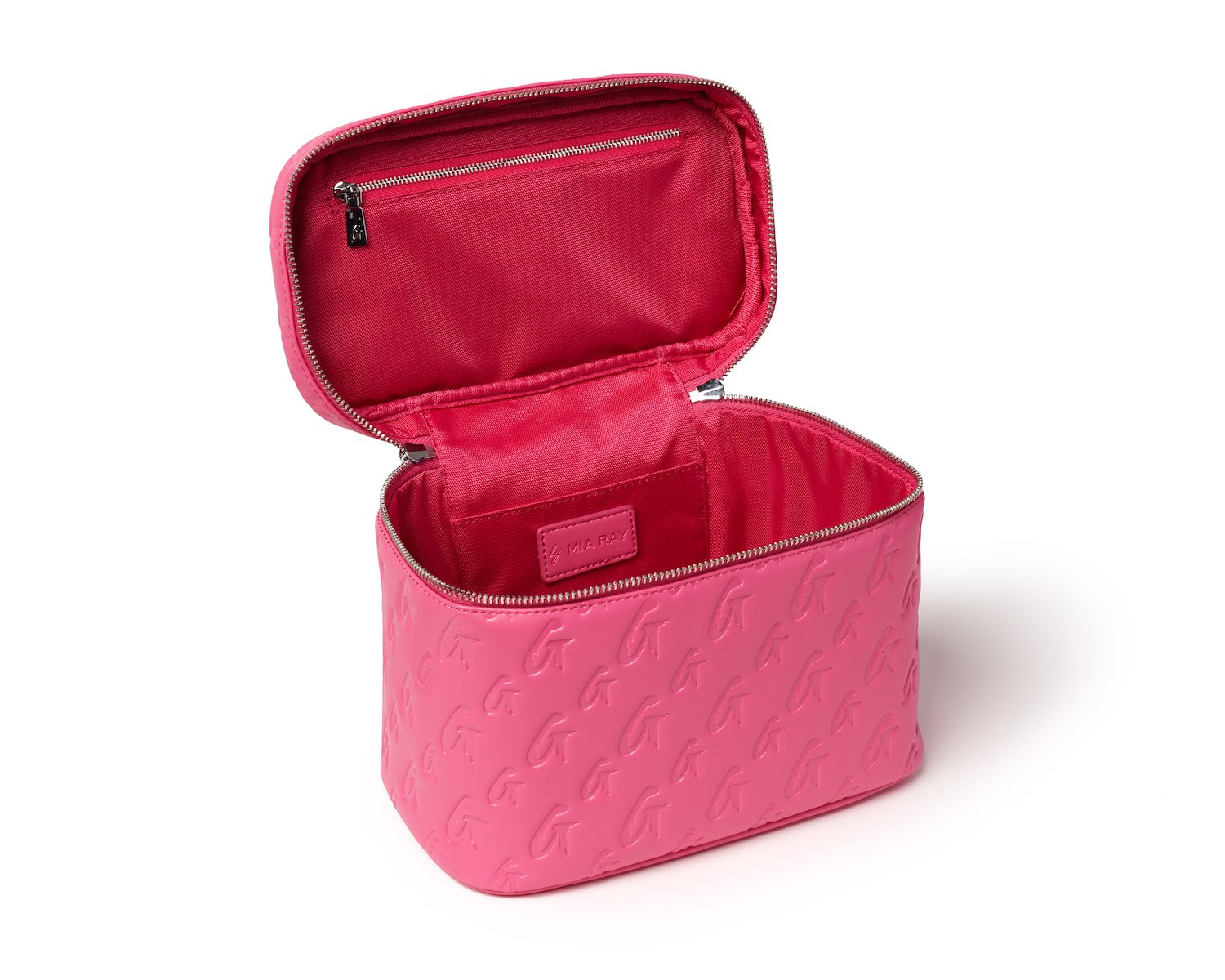 Large hot pink monogram toiletry bag with embossed logo pattern, open to show interior with zippered pocket and compartments.
