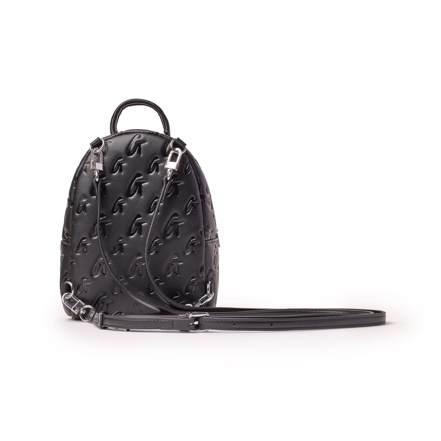 Black mini monogram backpack with embossed G pattern, top handle, adjustable strap, and silver hardware details.