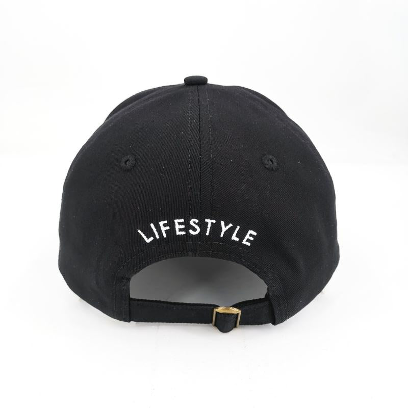 Black dad hat with "LIFESTYLE" embroidered in white on the back, adjustable strap, casual and stylish accessory.