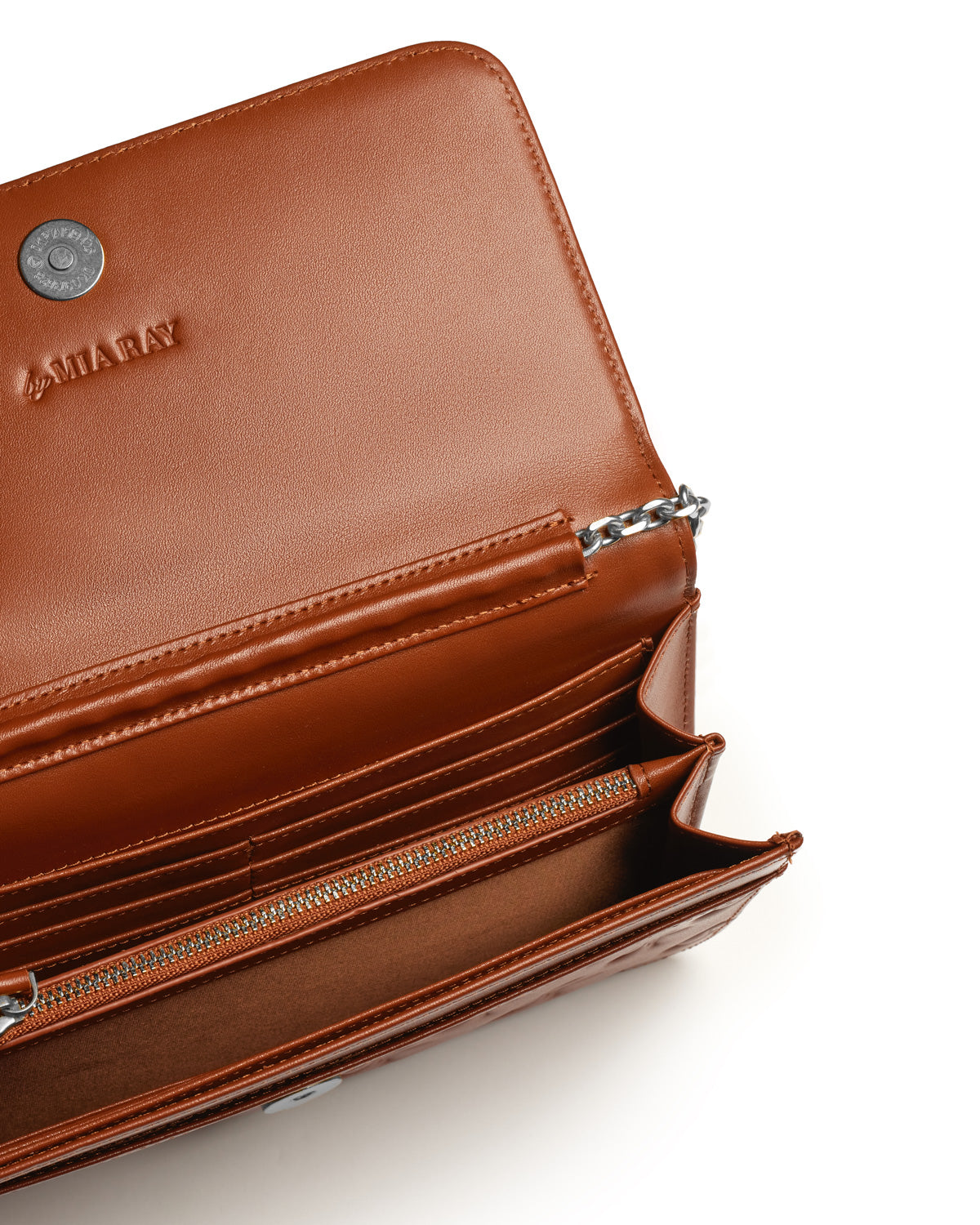Open brown leather wallet with multiple card slots, a zippered compartment, and a silver chain detail inside.