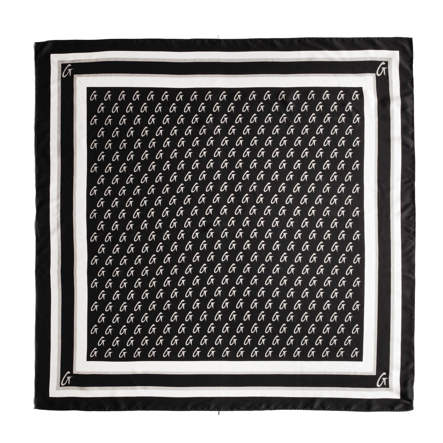 Large black silk scarf with a monogram pattern featuring white G logos, bordered by black and white stripes.