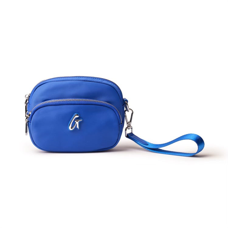 Blue nylon double zip wristlet with a strap, featuring a silver logo and multiple compartments for essentials.