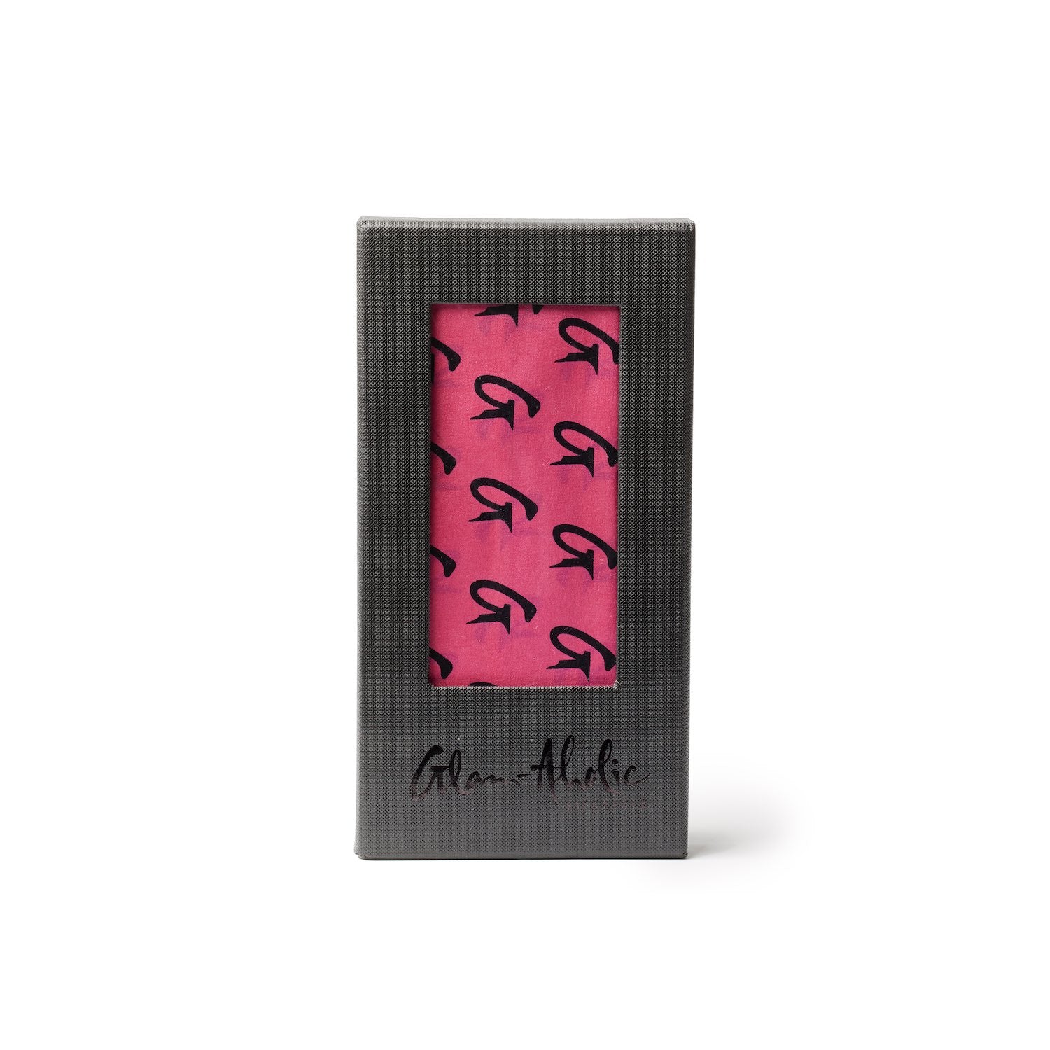 Large hot pink silk scarf with black monogram pattern, packaged in a black box with a window display.